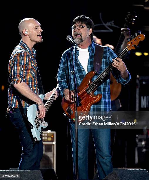 Bassist Jon Jones of the Eli Young Band and bassist Teddy Gentry of Alabama perform onstage during ACM Presents: Superstar Duets at Globe Life Park...