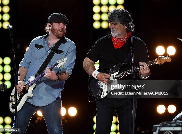 Guitarist James Young of the Eli Young Band and singer/guitarist Randy Owen of Alabama perform during ACM Presents: Superstar Duets at Globe Life...