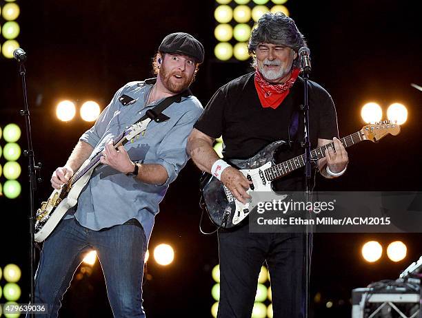 Guitarist James Young of the Eli Young Band and singer/guitarist Randy Owen of Alabama perform during ACM Presents: Superstar Duets at Globe Life...