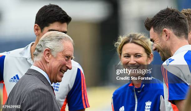 Prince Charles, Prince of Wales shares a joke with England cricketers Alastair Cook Charlotte Edwards and James Anderson during a Royal visit ahead...