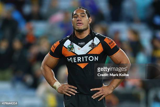 Martin Taupau of the Wests Tigers looks dejected during the round 17 NRL match between the Wests Tigers and the Parramatta Eels at ANZ Stadium on...