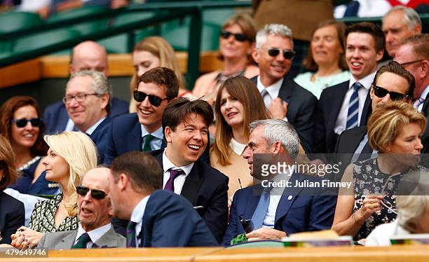 Comedian Michael McIntyre, Paul McGinley and wife Alison McGinley on Centre Court for the Ladies' Singles Fourth Round match between Serena Williams...