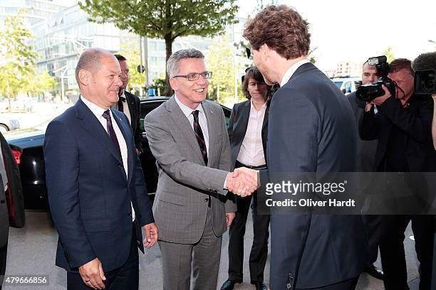 Thomas de Maiziere , CEO of the Olympia Hamburg 2024 Nikolas Hill and First mayor of Hamburg Olaf Scholz before the press conference on July 6, 2015...