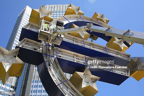 The Euro sculpture, near the old ECB headquarters, undergoes maintenance on July 6, 2015 in Frankfurt, Germany. The DAX dropped slightly in the...