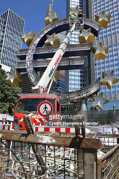 The Euro sculpture, near the old ECB headquarters, undergoes maintenance on July 6, 2015 in Frankfurt, Germany. The DAX dropped slightly in the...