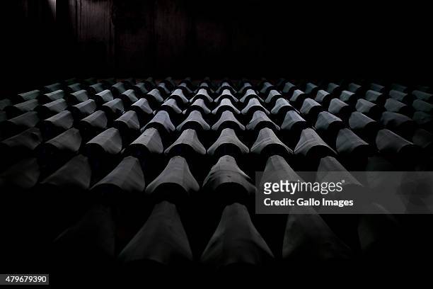 Coffins wait in Dutch Bat III on July 10, 2014 at the Srebrenica- Potocari Memorial and Cemetery at Potocari, Bosnia. During the 1992-1995 Bosnian...