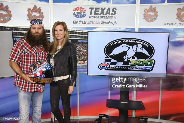 Duck Commander CEO Willie Robertson and wife Korie Robertson pose after the press conference for the unveiling of "Big Hoss" the largest HD video...