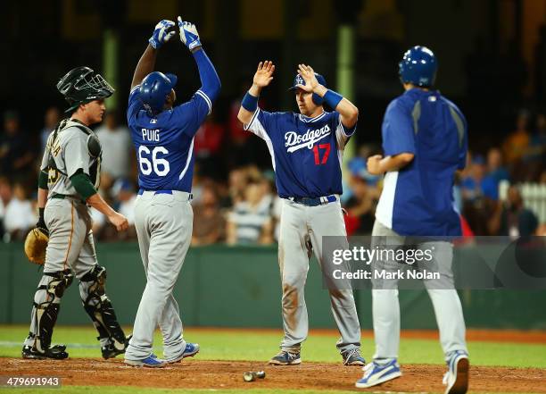 Yaseil Puig and A.J. Ellis of the Dodgers celebrate home runs during the match between Team Australia and the LA Dodgers at Sydney Cricket Ground on...