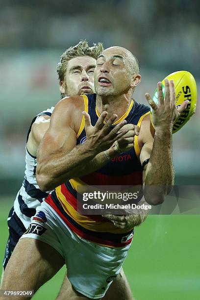 James Podsiadly of the Crows and Tom Lonergan of the Cats contest for the ball during the round one AFL match between the Geelong Cats and the...