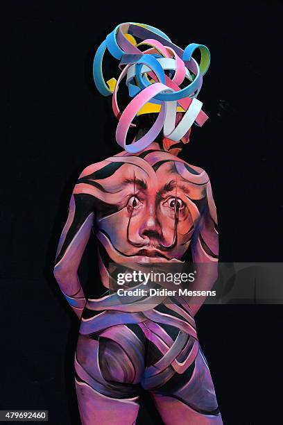 Participant poses with her facepainting designed by bodypainting artist 7 Dinda Sanatan from India, in the 2015 World Bodypainting Festival on July...