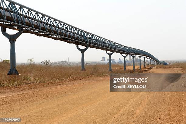 Picture shows a pipeline leading to the Dangote Industries cement plant under construction in Pout, some 50 km from Dakar, on February 6, 2014. The...