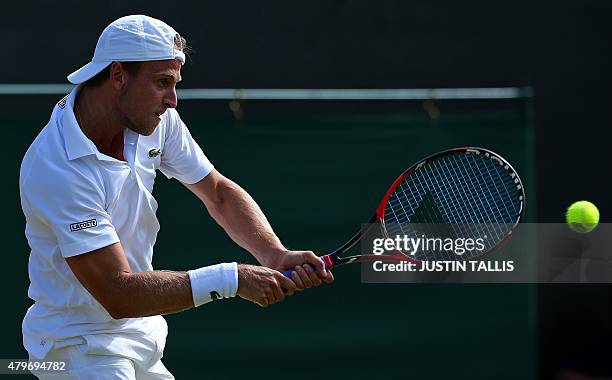 Player Denis Kudla returns to Croatia's Marin Cilic during their men's singles fourth round match on day seven of the 2015 Wimbledon Championships at...