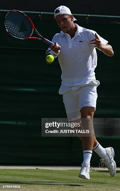 Player Denis Kudla returns to Croatia's Marin Cilic during their men's singles fourth round match on day seven of the 2015 Wimbledon Championships at...