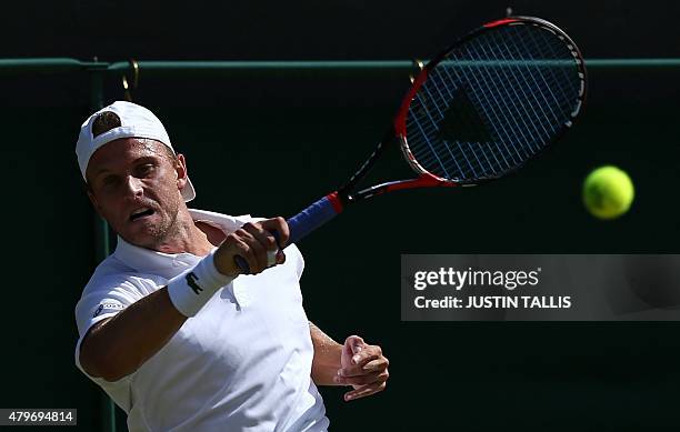 Player Denis Kudla returns to Croatia's Marin Cilic during their men's singles fourth round match on day seven of the 2015 Wimbledon Championships at...