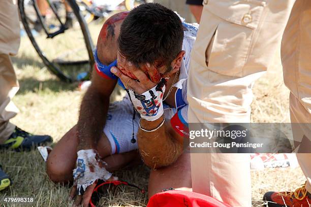 William Bonnet of France riding for FDJ is attended to after being involved in a crash with 65km remaining in stage three of the 2015 Tour de France...