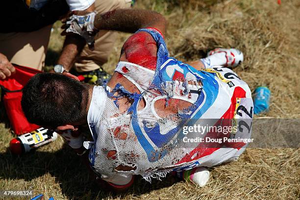 William Bonnet of France riding for FDJ is attended to after being involved in a crash with 65km remaining in stage three of the 2015 Tour de France...