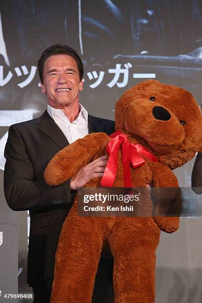 Arnold Schwarzenegger receives a teddy bear during the Tokyo Premiere of 'Terminator Genisys' at the Roppongi Hills Arena on July 6, 2015 in Tokyo,...