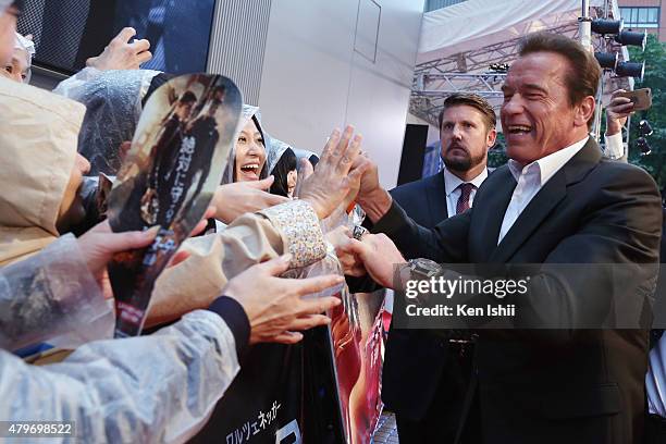 Arnold Schwarzenegger greets fans during the Tokyo Premiere of 'Terminator Genisys' at the Roppongi Hills Arena on July 6, 2015 in Tokyo, Japan.