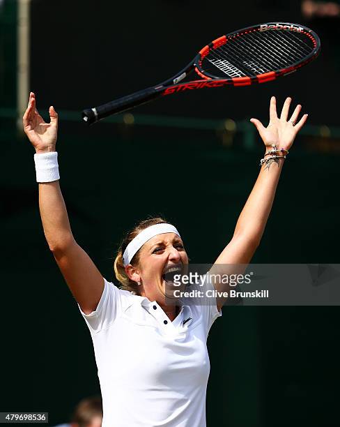Timea Bacsinszky of Switzerland celebrates match point in her Ladies' Singles Fourth Round match against Monica Niculescu of Romania during day seven...