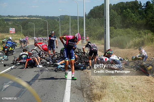 Filippo Pozzato of Italy and Lampre-Merida adjusts his clothing following a crash near Brabant Wallon during stage three of the 2015 Tour de France,...