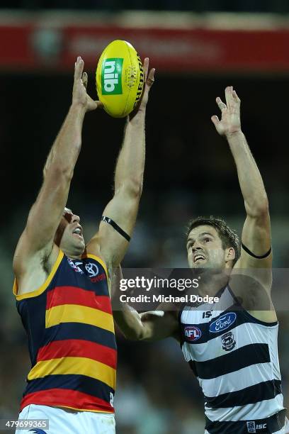 James Podsiadly of the Crows marks the ball against Jared Rivers of the Cats during the round one AFL match between the Geelong Cats and the Adelaide...