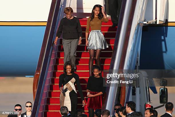 First Lady Michelle Obama with her mother Marian Robinson, daughters Sasha Obama and Malia Obama arrives at Beijing Capital International Airport on...