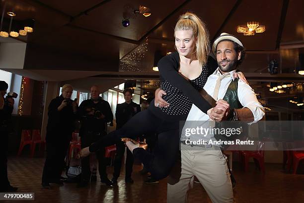 Larissa Marolt and Massimo Sinato pose at a photo call for the television competition 'Let's Dance' on March 20, 2014 in Cologne, Germany. On March...