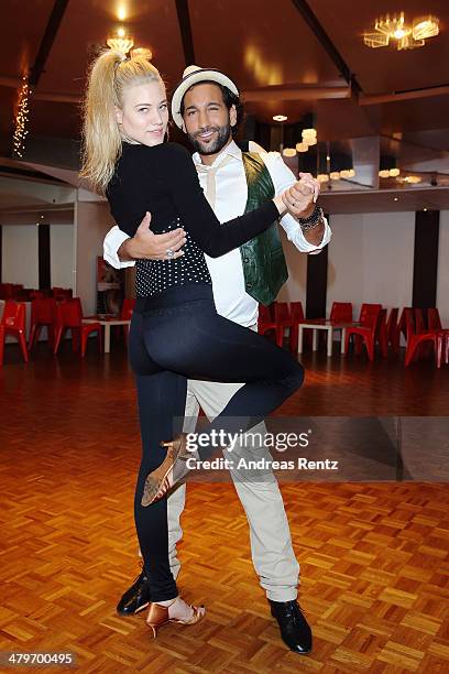 Larissa Marolt and Massimo Sinato pose at a photo call for the television competition 'Let's Dance' on March 20, 2014 in Cologne, Germany. On March...