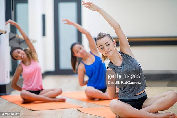 teenagers in yoga class - teenager yoga stock pictures, royalty-free photos & images