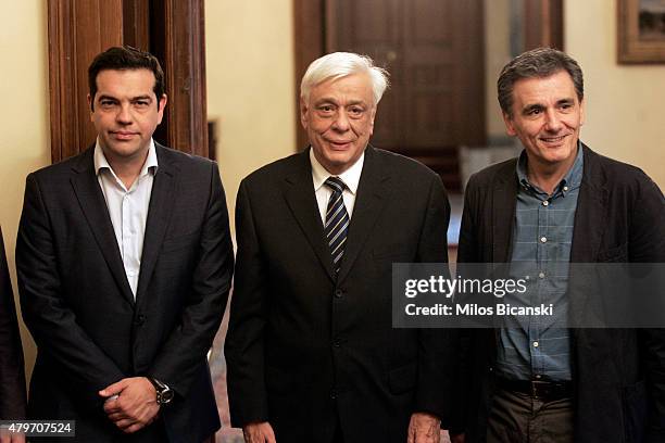 Greece's Prime Minister Alexis Tsipras , Greek President Prokopis Pavlopoulos and the new Greek Finance Minister Euclid Tsakalotos pose for the...