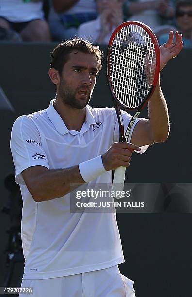 Croatia's Marin Cilic celenbrates beating US player Denis Kudla during their men's singles fourth round match on day seven of the 2015 Wimbledon...