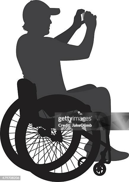 stockillustraties, clipart, cartoons en iconen met man in wheelchair taking photo - rolstoel