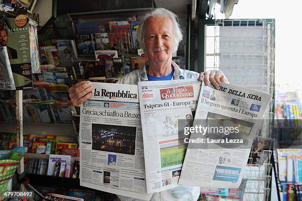 An Italian newsagent shows the major Italian newspapers the day after Greece's austerity referendum which dominates the Italian front pages today, on...
