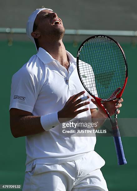 Player Denis Kudla reacts against Croatia's Marin Cilic during their men's singles fourth round match on day seven of the 2015 Wimbledon...