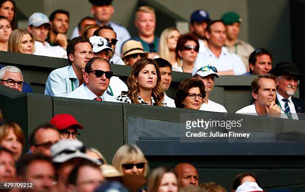 Wife Mirka Federer and Coach Stefan Edberg watch Roger Federer of Switzerland in his Gentlemen's Singles Fourth Round match against Roberto Bautista...