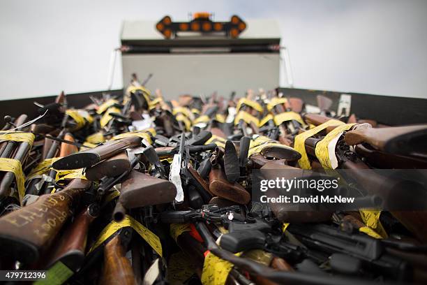 Guns fill the bed of a dump truck during the destruction of approximately 3,400 guns and other weapons at the Los Angeles County SheriffsÕ 22nd...