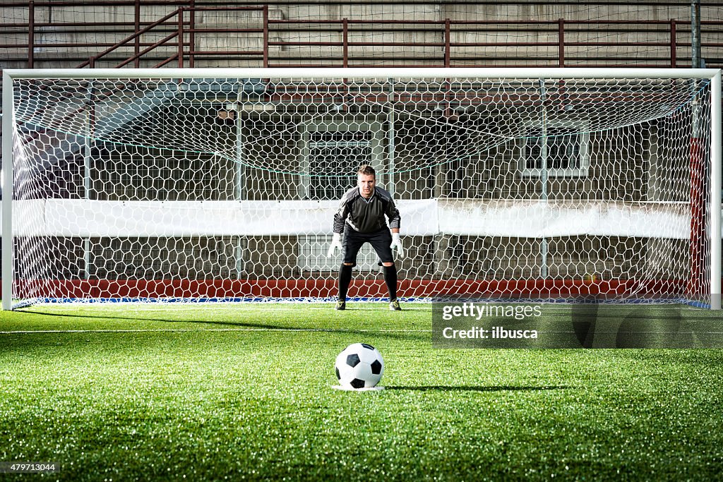 Jogo de futebol no Estádio: Cobrança de pênalti