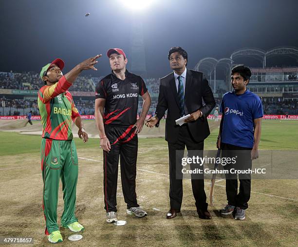 Mushfiqur Rahim, captain of Bangladesh, Jamie Atkinson, captain of Hong Kong, match referee Javagal Srinath and Pepsi mascot Salman at the coin toss...