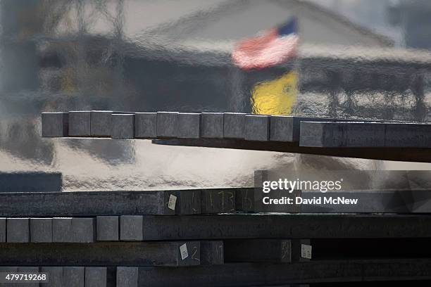 Fork lift driver stacks 1,800-degree billets, cooing from 3,000 degrees when emerging from the mill, during the destruction of approximately 3,400...