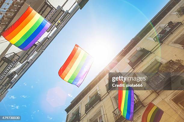 rainbow flag gay rights pride in madrid, spain - gay flag stockfoto's en -beelden