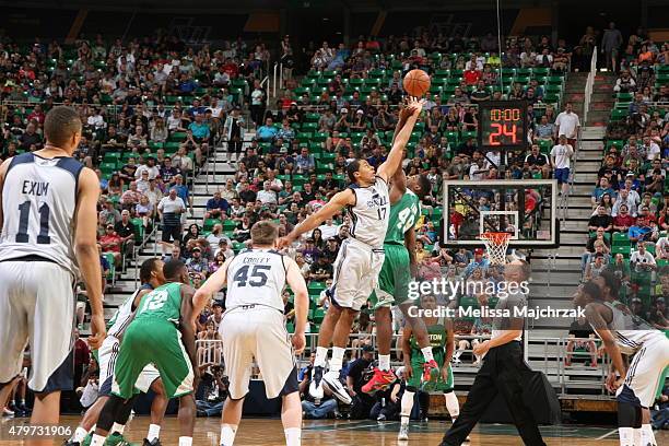 Grant Jerrett of the Utah Jazz goes up for the opening tip against C.J. Fair of the Boston Celtics during the NBA Summer League on July 6, 2015 at...