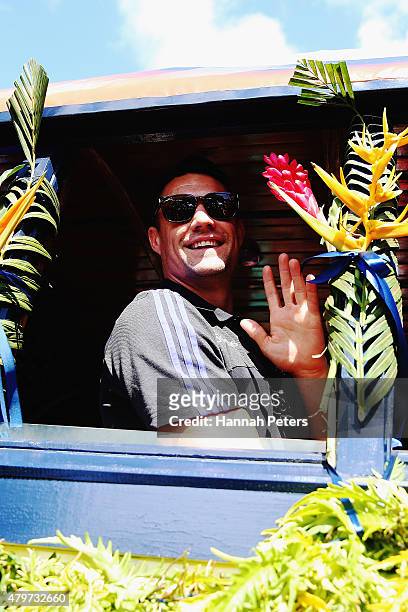 Daniel Carter of the New Zealand All Blacks waves to fans during a parade down the main street of Apia on July 7, 2015 in Apia, Samoa.