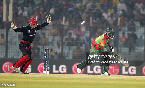 Rubel Hossain of Bangladesh is bowled during the ICC World Twenty20 match between Bangladesh and Hong Kong at Zahur Ahmed Chowdhury Stadium on March...