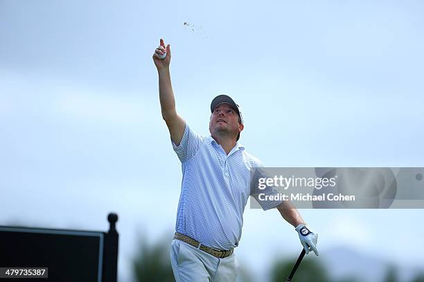 Tim Clark of South Africa tosses grass before hitting his drive during the second round of the Puerto Rico Open presented by seepuertorico.com held...