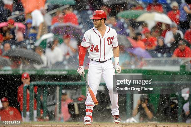 Bryce Harper of the Washington Nationals at bat when play is stopped for a rain delay in the first inning of the game against the Cincinnati Reds at...