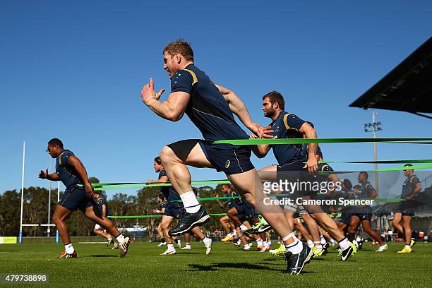 David Pocock of the Wallabies and team mates sprint during an Australian Wallabies training session at Sunshine Coast Stadium on July 7, 2015 in...