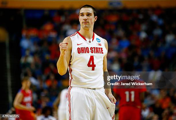 Aaron Craft of the Ohio State Buckeyes reacts against the Dayton Flyers during the second round of the 2014 NCAA Men's Basketball Tournament at the...