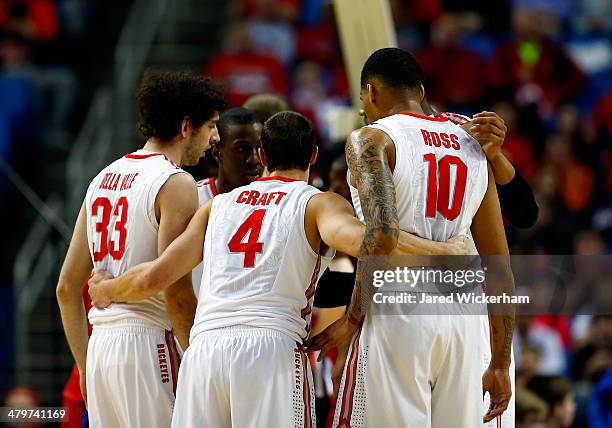 The Ohio State Buckeyes huddle during the second round of the 2014 NCAA Men's Basketball Tournament against the Dayton Flyers at the First Niagara...