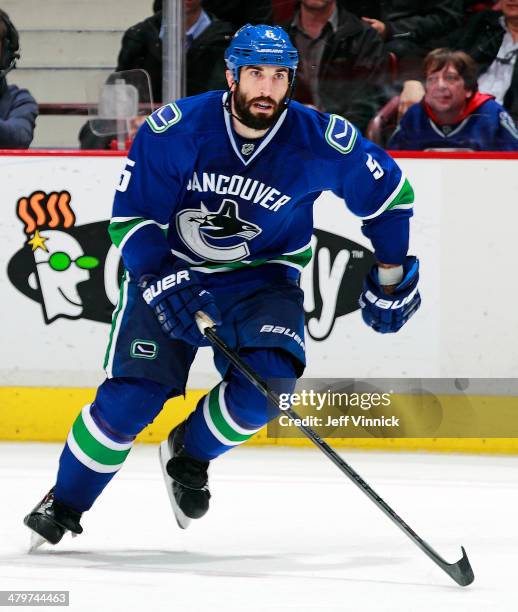 Jason Garrison of the Vancouver Canucks skates up ice during their NHL game against the New York Islanders at Rogers Arena March 10, 2014 in...