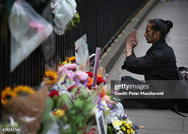 Man prays near a memorial to the victims of the July, 2005 bus bombing near Tavistock Square on July 7, 2015 in London, England. Today is the tenth...